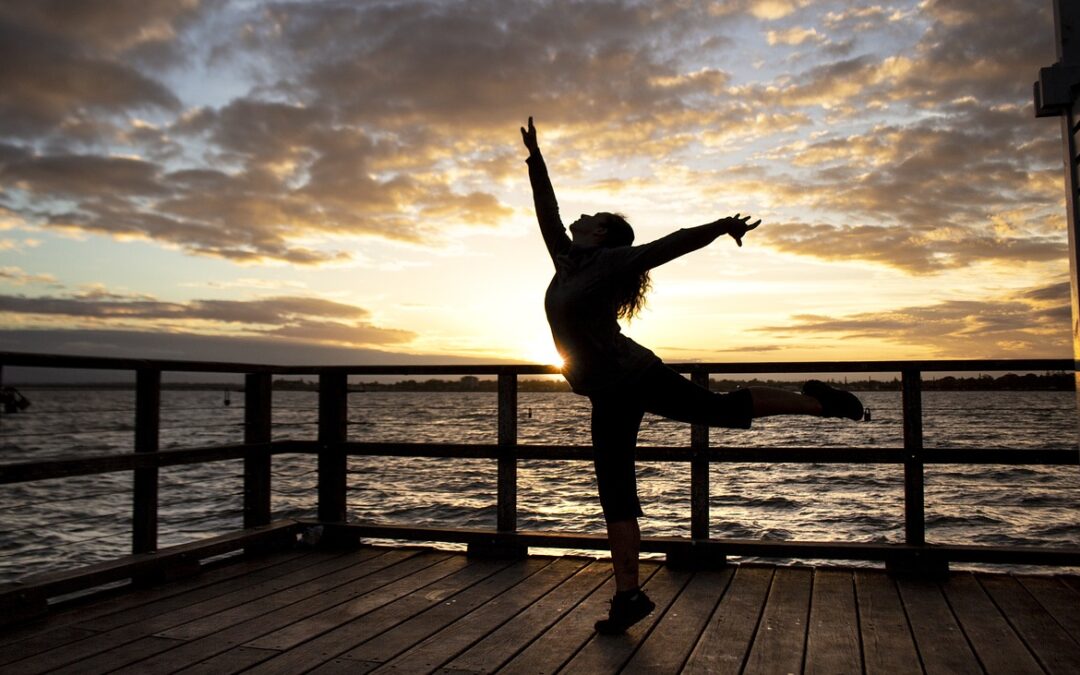 woman dancing at sunset